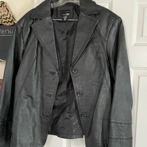 Genuine, leather jacket no tears stains are signs of wear.